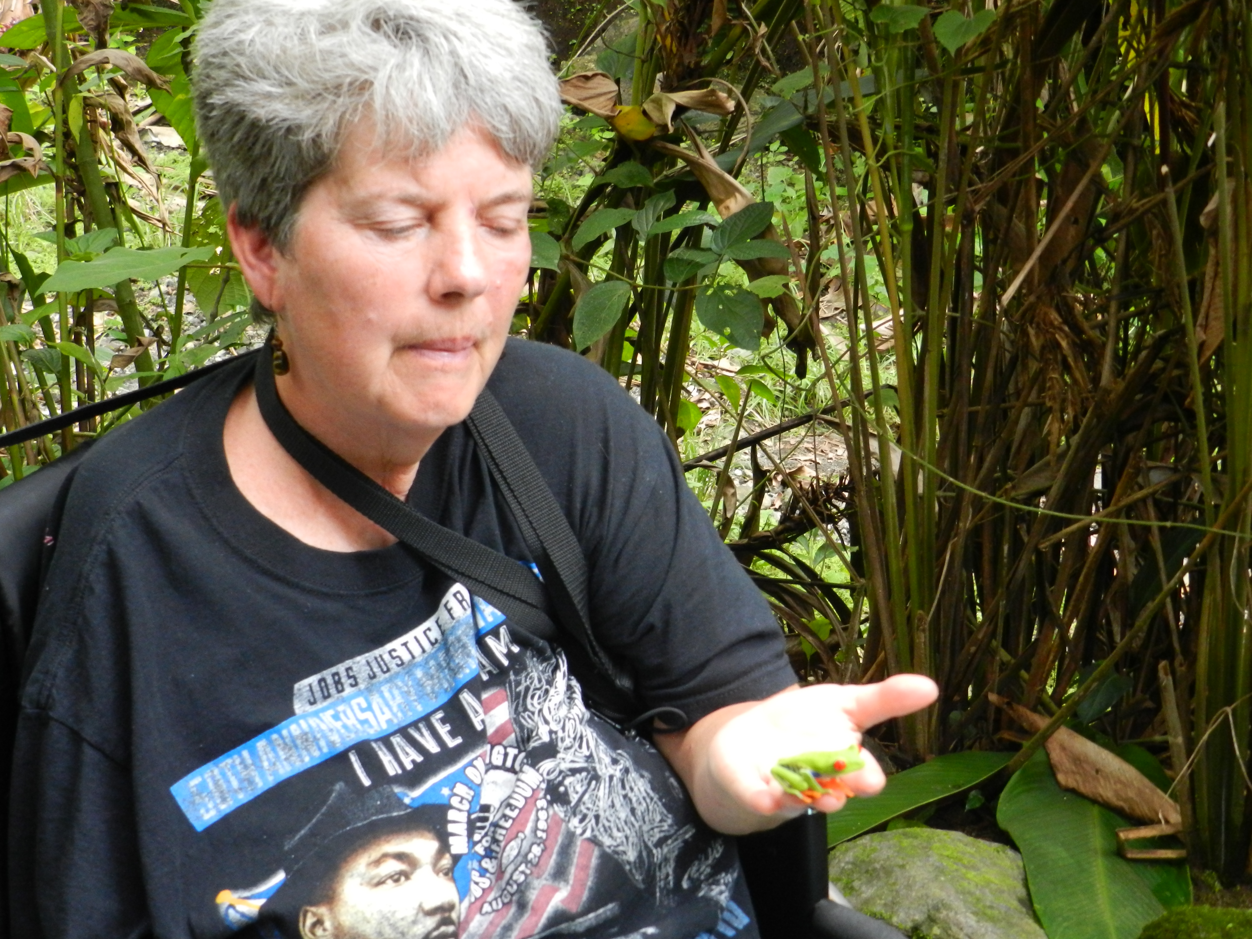 Ann Stark holding tree frog in Costa Rica